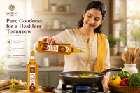 Woman pouring Lusha oil into a pan with vegetables in a kitchen setting.